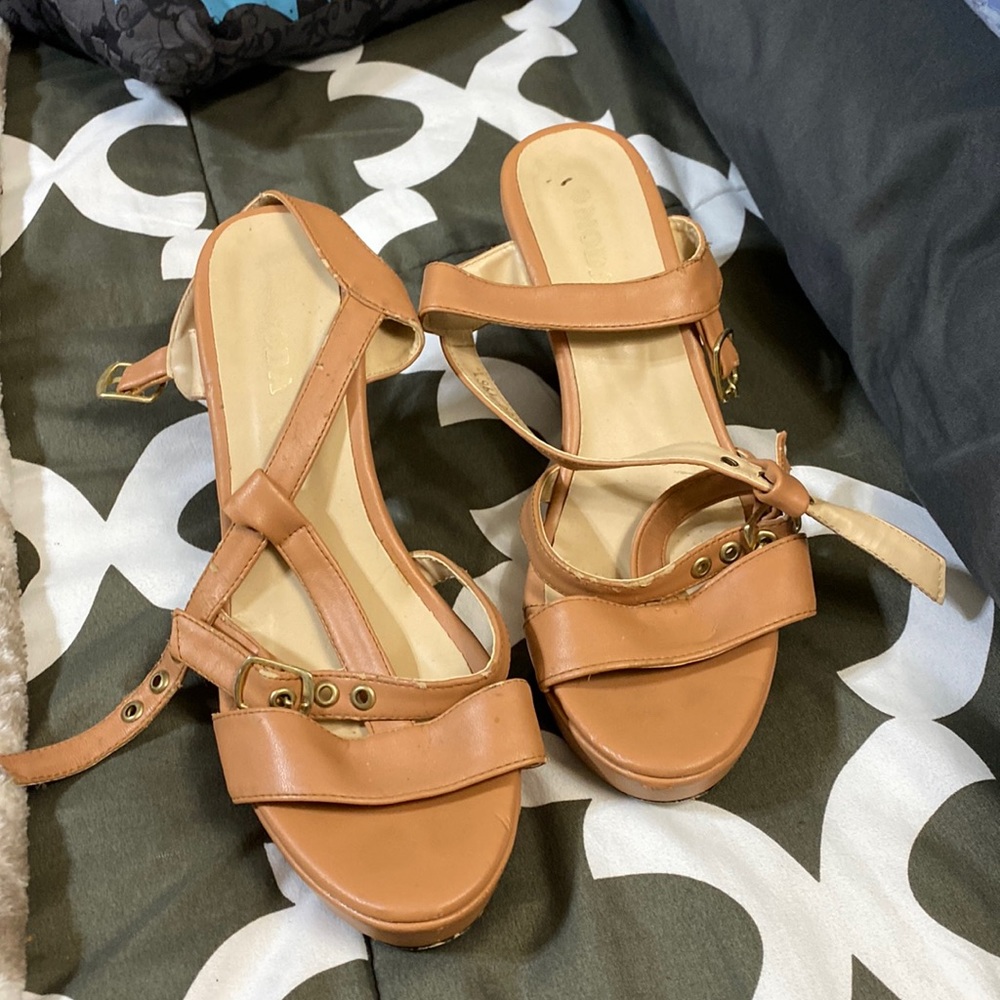 Tan platform heels, 2 inches in the back he’ll say seven